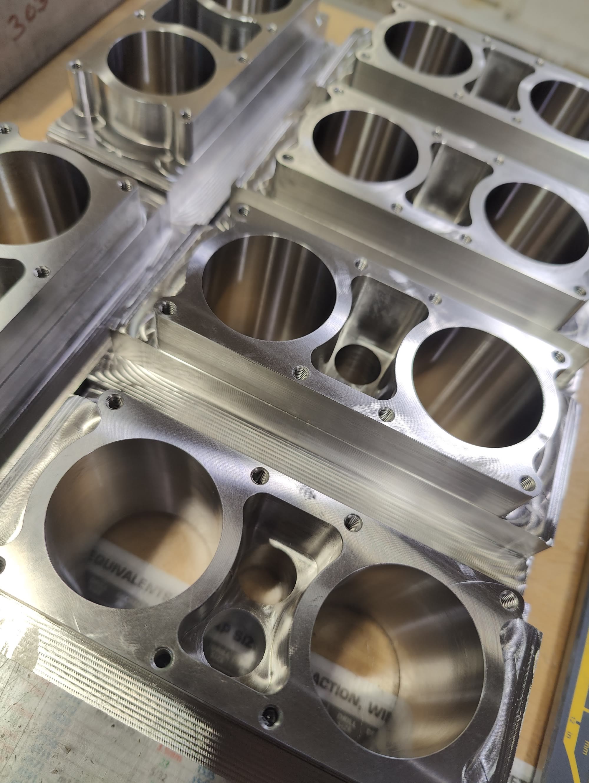 Multi-sided stainless part with precision-bored hole