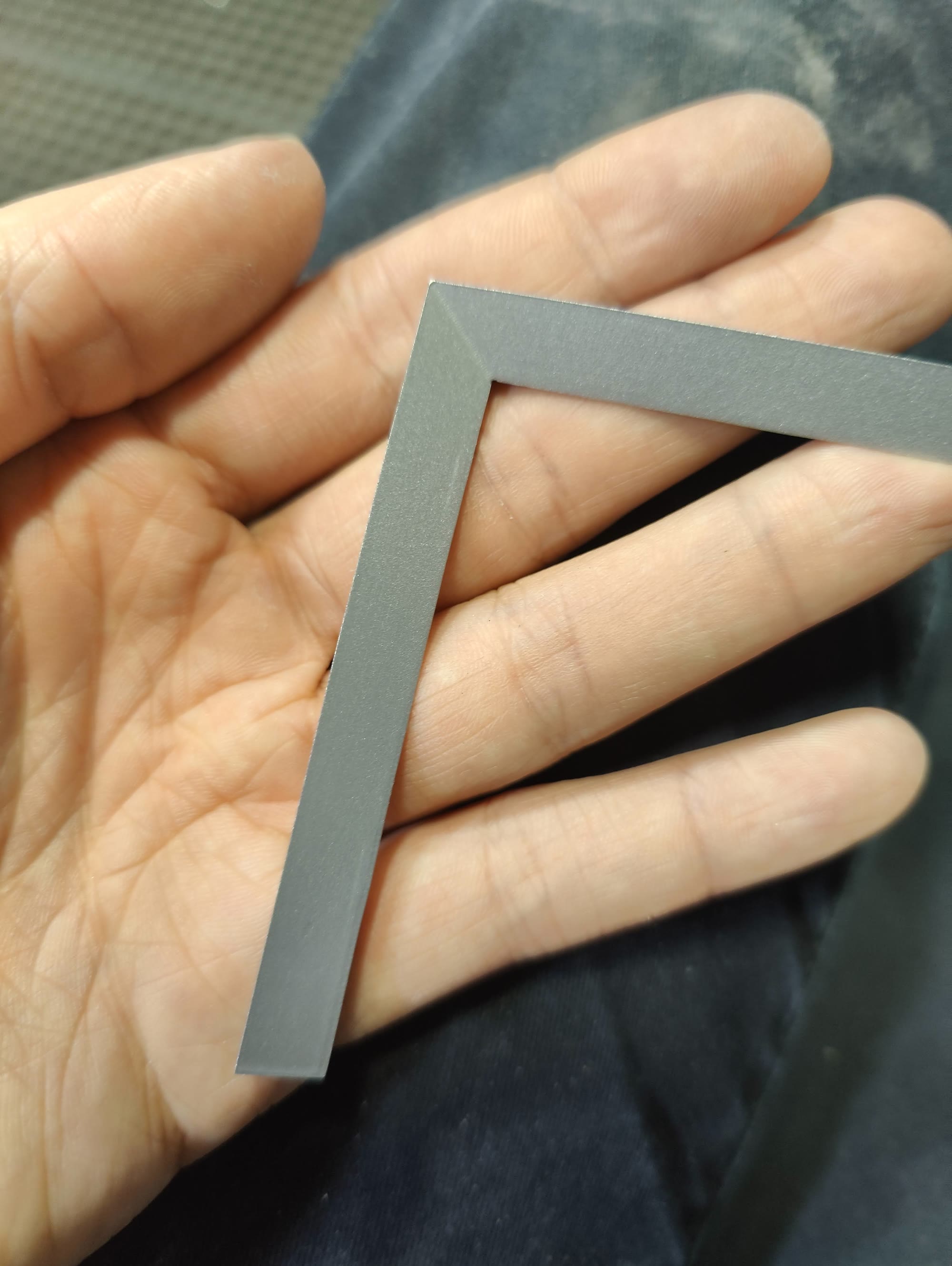 Tabbed hard-to-hold part